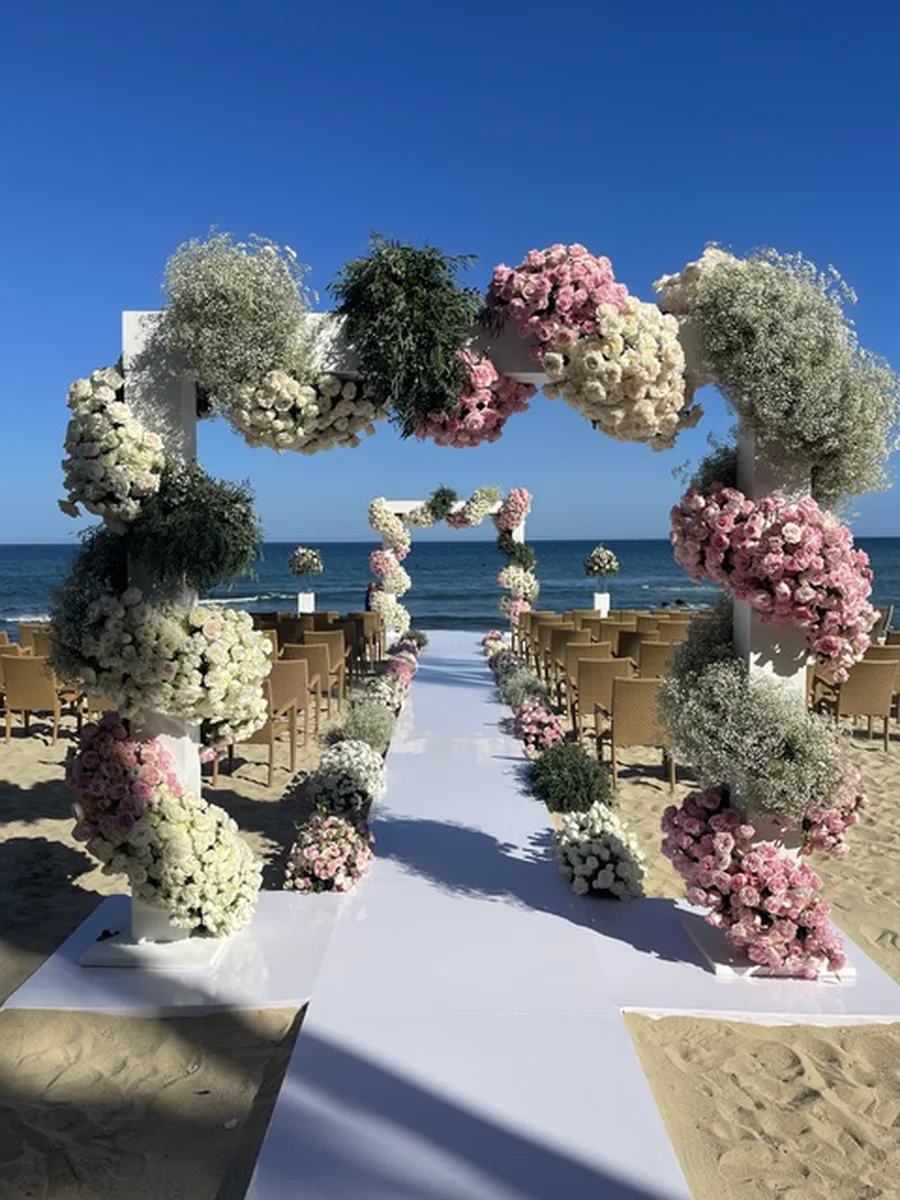 Beach aisle with floral arch